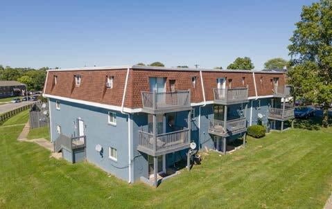 Park Vista, a three-story apartment community in Lexington, Kentucky, with private balconies and landscaped lawns